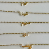 Custom Arabic, Urdu, Farsi or English name necklace in 18k gold from Kenz Jewelry.